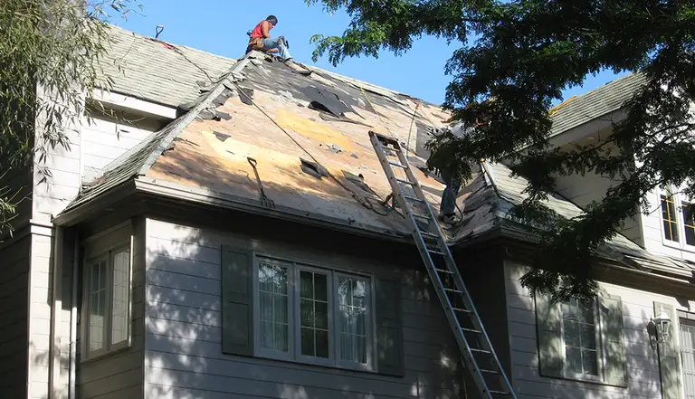 Anax Roofing emergency repair crew responding to roof damage